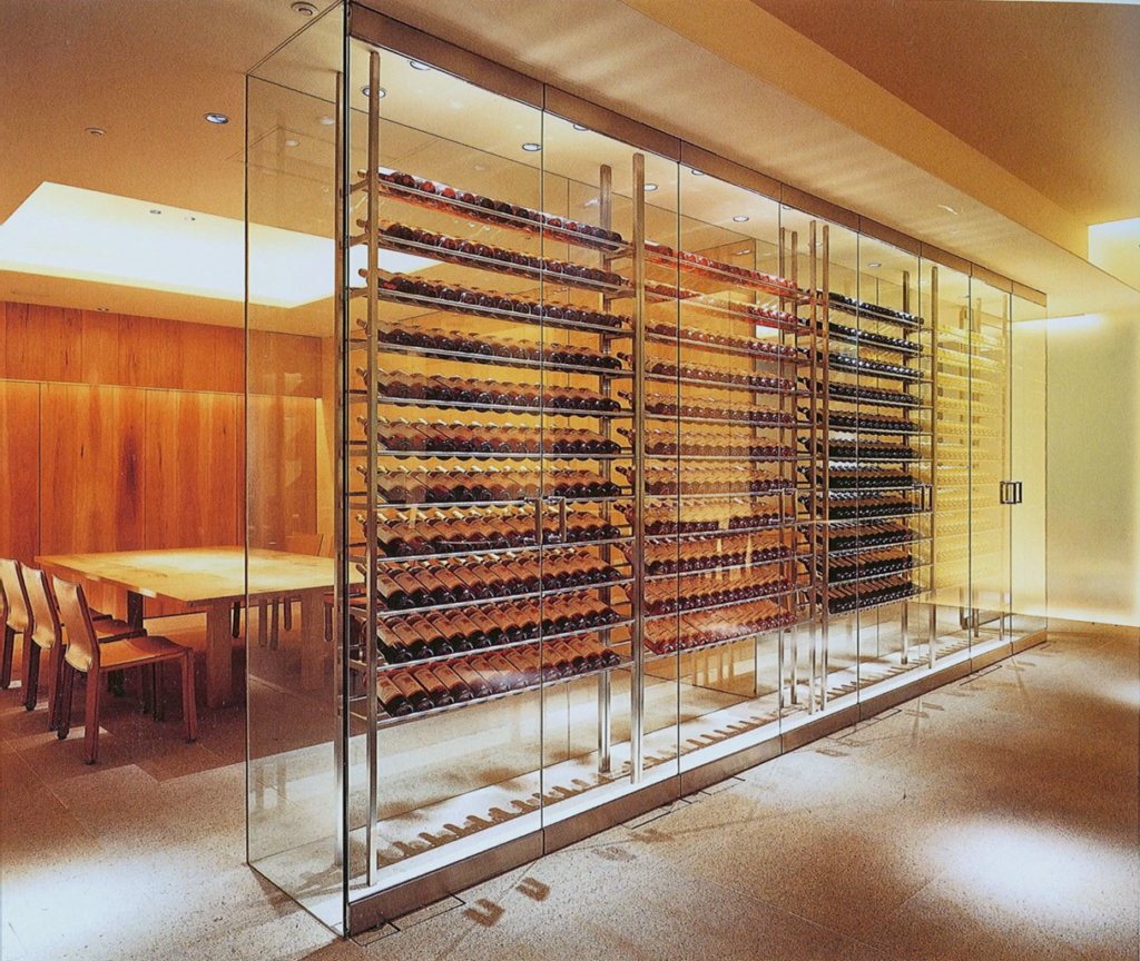 glass wine cellar with metal wine racks