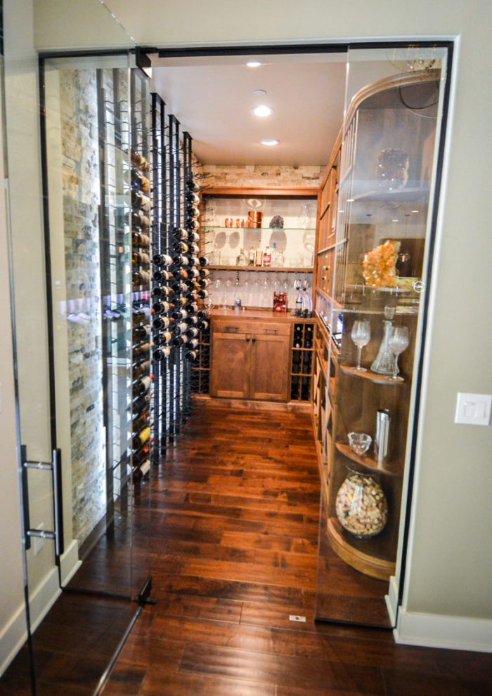 Transitional Residential Custom Wine Cellar in Austin with Metal and Wood Wine Racks