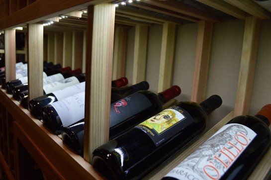 Small Wine Cellar with Display Row with Lighting Installed by Austin Builders