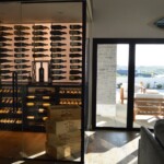 The glass-enclosed wine cellar looks great for this client's home.