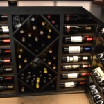 You can store various wine bottle sizes due to the diversity of wine racking design installed in this glass wine cellar.