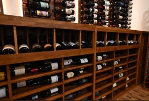 9 -Temperature-controlled wine room with custom wine racks in Austin, TX. Austin-built custom wine racks.