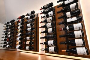 8 - Contemporary Meets Classic in These Custom Wine Racks in Austin Contemporary custom wine racks with alderwood and LED lighting in Austin cellar.